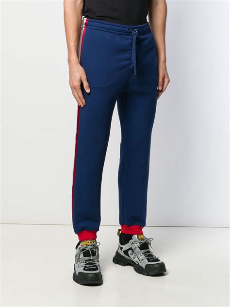 gucci side stripe track pants.